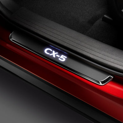 Front trim plate with illuminated CX-5 logo