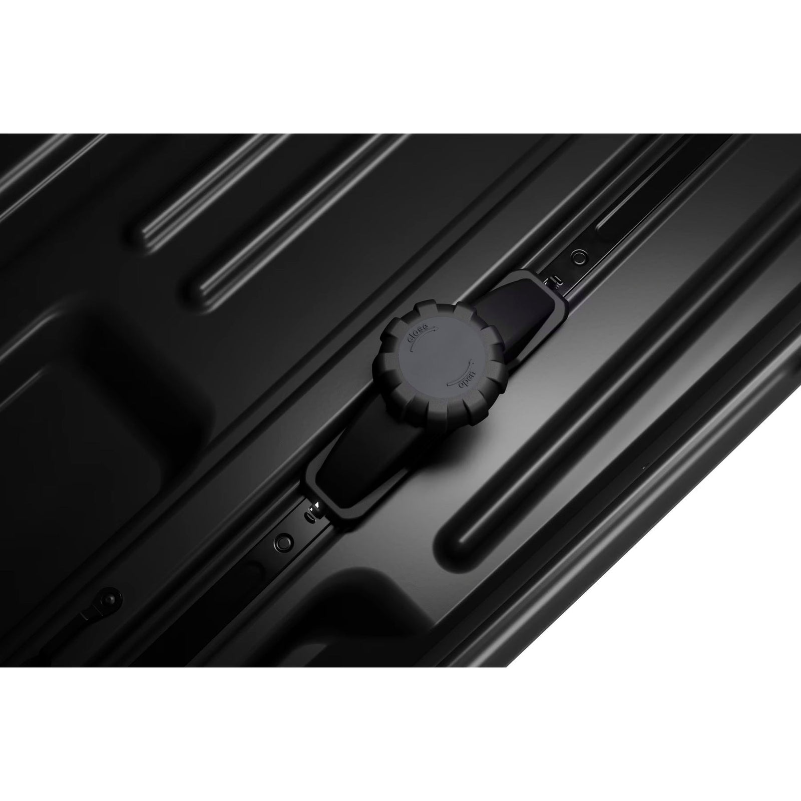 Close-up of a black suitcase handle on a white background