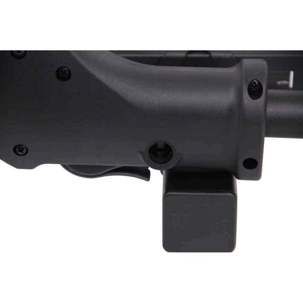 Close-up of a black firearm stock on a white background